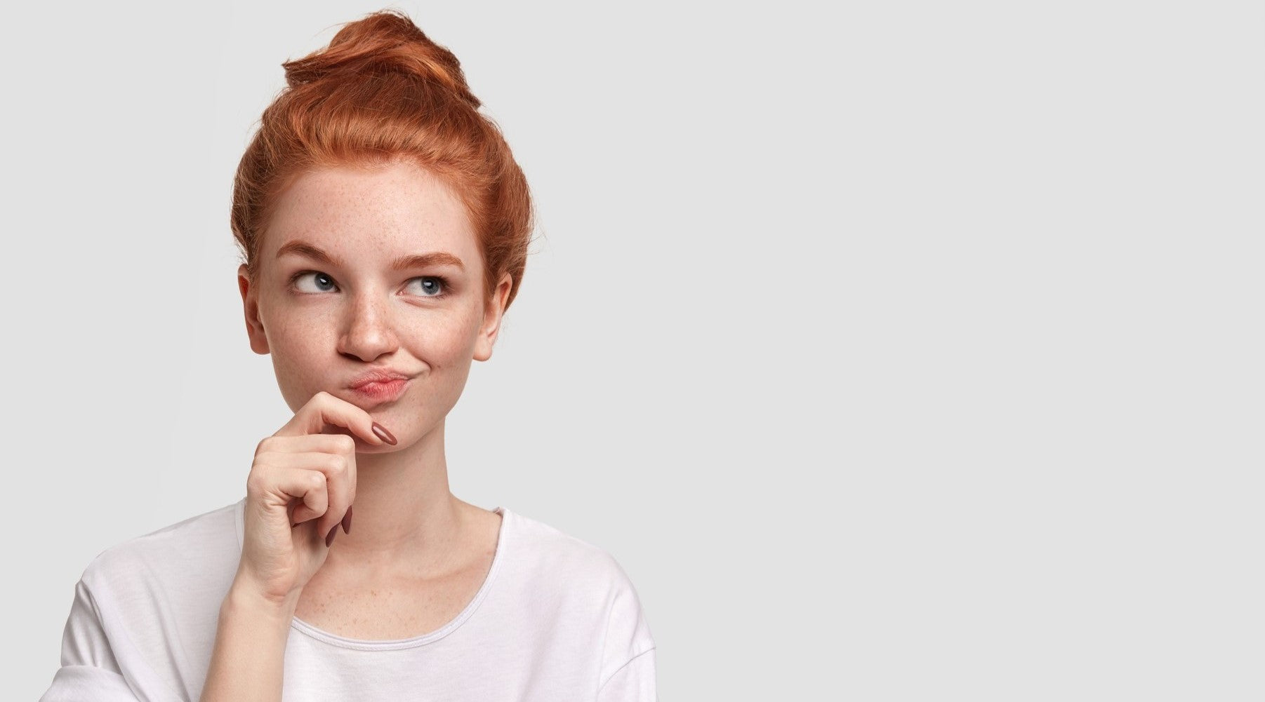 A pensive redhead