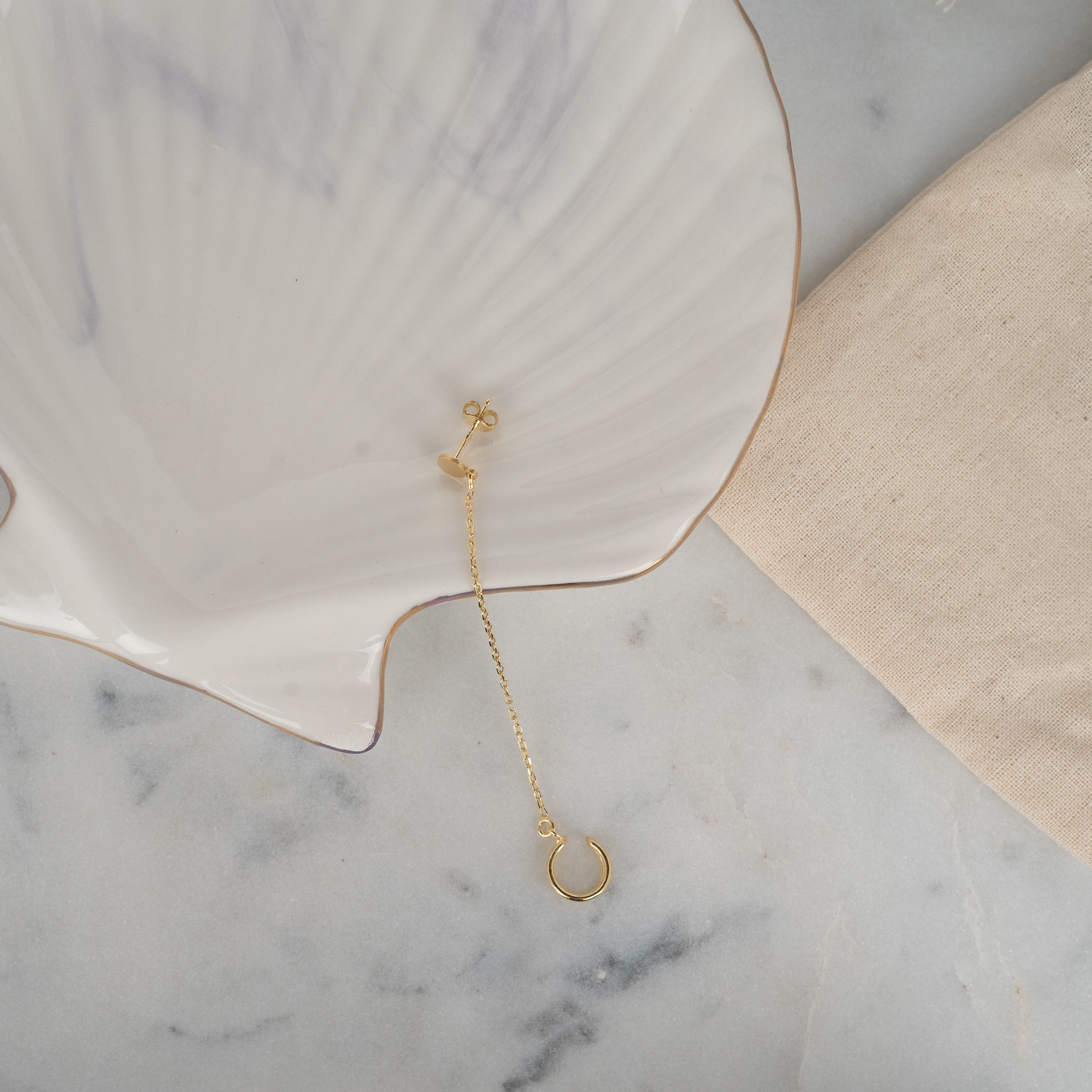 925 silver gold ear cuff earrings set on marble