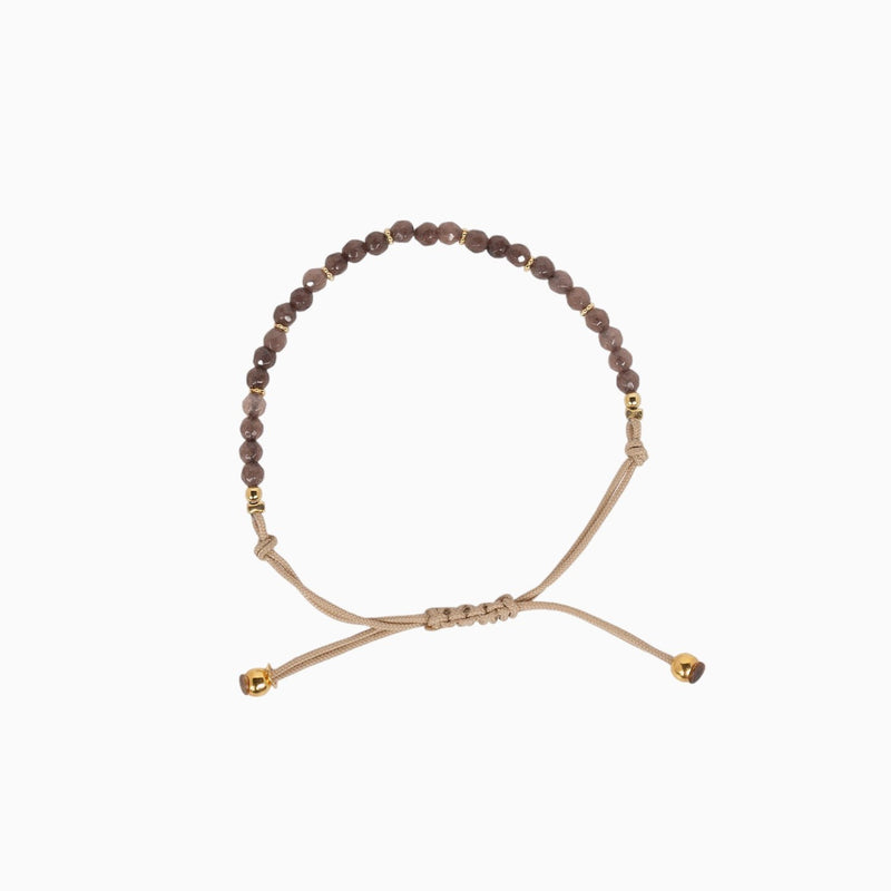 Bracelet en coton beige avec des pierres brunes