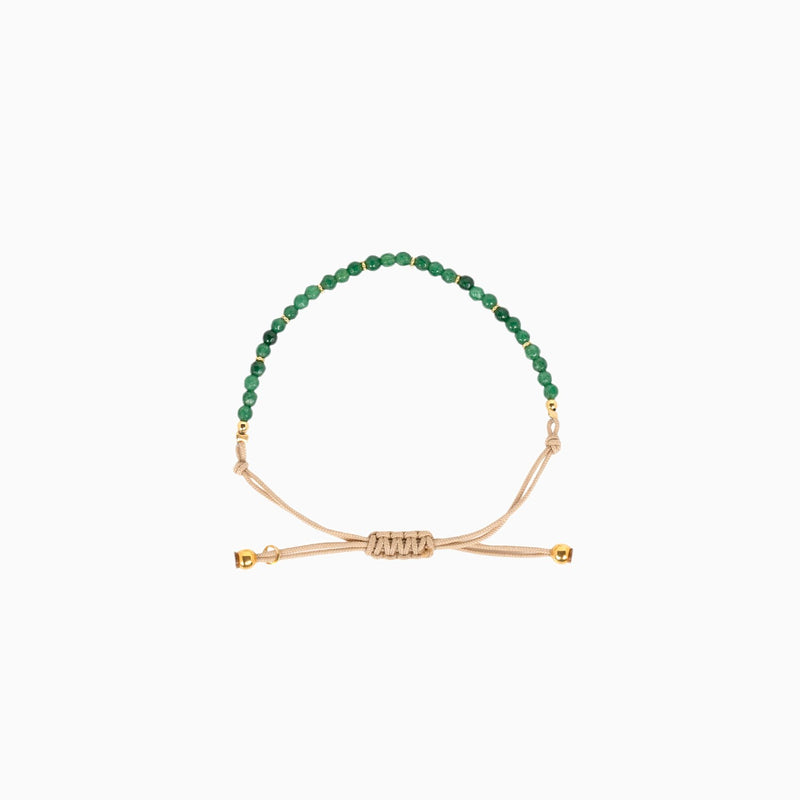 Bracelet en coton beige avec des pierres vertes